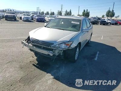 Zdjęcie 14 z 14 samochodu: 2002 TOYOTA CAMRY LE VIN:JTDBF30K620005894 - miniatura