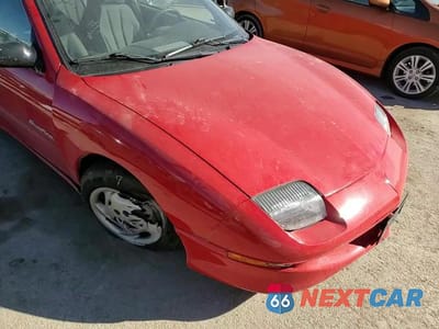 Zdjęcie 11 z 14 samochodu: 1999 PONTIAC SUNFIRE SE VIN:1G2JB1247X7533392 - miniatura