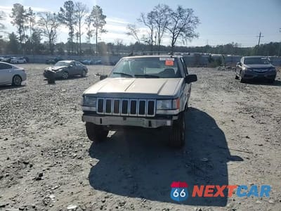 Zdjęcie 11 z 14 samochodu: 1997 JEEP GRAND CHEROKEE LAREDO VIN:1J4FX58S0VC770823 - miniatura