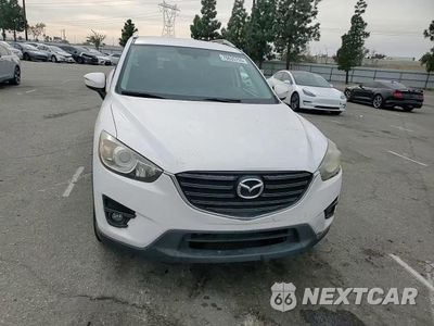Zdjęcie 14 z 14 samochodu: 2016 MAZDA CX-5 TOURING VIN:JM3KE2CY0G0685772 - miniatura