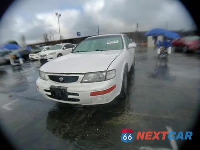 Zdjęcie 10 z 13 samochodu: 1995 NISSAN MAXIMA GLE VIN:JN1CA21D8ST662596 - miniatura