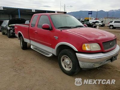 Zdjęcie 10 z 14 samochodu: 2000 FORD F150 VIN:1FTRX18L6YNA54652 - miniatura