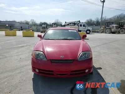 Zdjęcie 11 z 14 samochodu: 2004 HYUNDAI TIBURON VIN:KMHHM65D14U105288 - miniatura