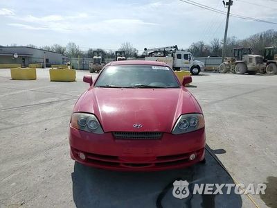 Zdjęcie 11 z 14 samochodu: 2004 HYUNDAI TIBURON VIN:KMHHM65D14U105288 - miniatura
