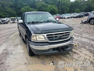 Zdjęcie 13 z 14 samochodu: 2001 FORD F150 VIN:1FTRX17W01NA49853 - miniatura