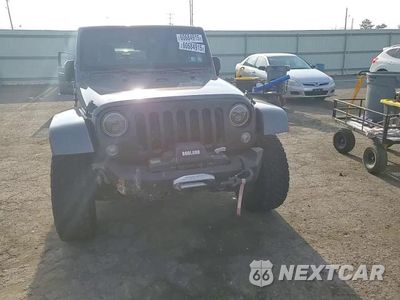 Zdjęcie 14 z 15 samochodu: 2014 JEEP WRANGLER UNLIMITED SAHARA VIN:1C4HJWEG9EL240338 - miniatura