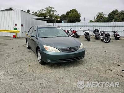 Zdjęcie 13 z 14 samochodu: 2002 TOYOTA CAMRY LE VIN:4T1BF30KX2U526217 - miniatura