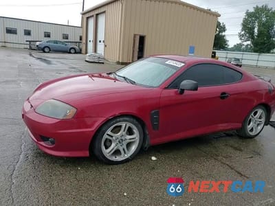 Zdjęcie 13 z 14 samochodu: 2005 HYUNDAI TIBURON GT VIN:KMHHN65F25U164141 - miniatura