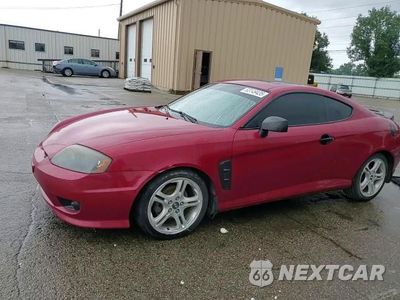 Zdjęcie 13 z 14 samochodu: 2005 HYUNDAI TIBURON GT VIN:KMHHN65F25U164141 - miniatura