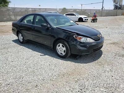 Zdjęcie 13 z 14 samochodu: 2002 TOYOTA CAMRY LE VIN:4T1BF32K22U523065 - miniatura