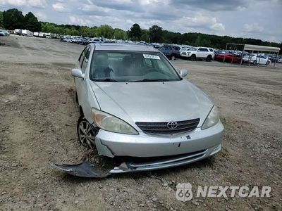 Zdjęcie 13 z 14 samochodu: 2004 TOYOTA CAMRY LE VIN:4T1BF30K54U571522 - miniatura