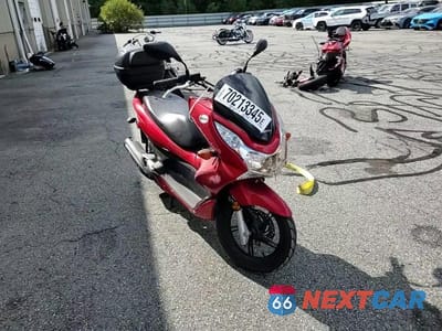Zdjęcie 10 z 10 samochodu: 2013 HONDA PCX 150 VIN:MLHKF1213D5004746 - miniatura