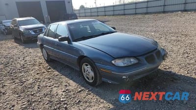 Zdjęcie 13 z 14 samochodu: 1998 PONTIAC GRAND AM SE VIN:1G2NE52M5WM524027 - miniatura