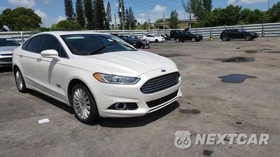 Zdjęcie 13 z 14 samochodu: 2014 FORD FUSION TITANIUM PHEV VIN:3FA6P0SU3ER216962 - miniatura