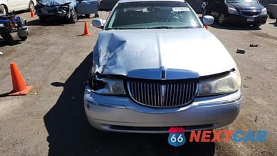 Zdjęcie 13 z 14 samochodu: 1999 LINCOLN TOWN CAR CARTIER VIN:1LNHM83W7XY621331 - miniatura