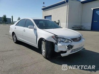 Zdjęcie 14 z 15 samochodu: 2005 TOYOTA CAMRY LE VIN:4T1BF30KX5U093499 - miniatura