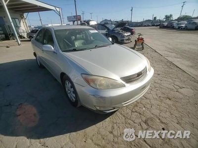 Zdjęcie 14 z 15 samochodu: 2003 TOYOTA CAMRY LE VIN:4T1BE32K53U733552 - miniatura