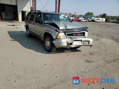 Zdjęcie 14 z 15 samochodu: 1999 GMC JIMMY VIN:1GKDT13W6X2514954 - miniatura