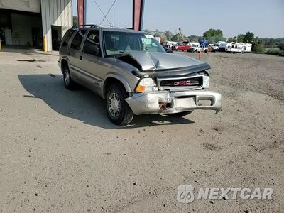 Zdjęcie 14 z 15 samochodu: 1999 GMC JIMMY VIN:1GKDT13W6X2514954 - miniatura