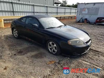 Zdjęcie 13 z 14 samochodu: 2005 HYUNDAI TIBURON VIN:KMHHM65D65U178514 - miniatura