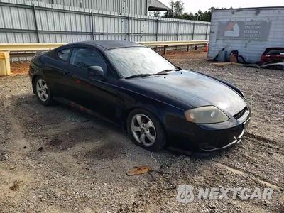 Zdjęcie 13 z 14 samochodu: 2005 HYUNDAI TIBURON VIN:KMHHM65D65U178514 - miniatura