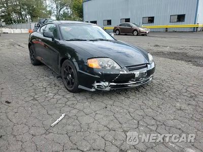 Zdjęcie 13 z 13 samochodu: 2003 HYUNDAI TIBURON VIN:KMHHN65F13U077098 - miniatura
