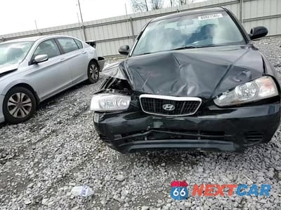 Zdjęcie 13 z 14 samochodu: 2002 HYUNDAI ELANTRA GLS VIN:KMHDN45D72U427687 - miniatura