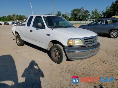 Zdjęcie 13 z 14 samochodu: 2003 FORD F150 VIN:1FTRX17203NB45949 - miniatura