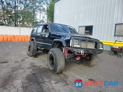 Zdjęcie 13 z 14 samochodu: 1999 JEEP CHEROKEE SE VIN:1J4FT28P3XL595475 - miniatura