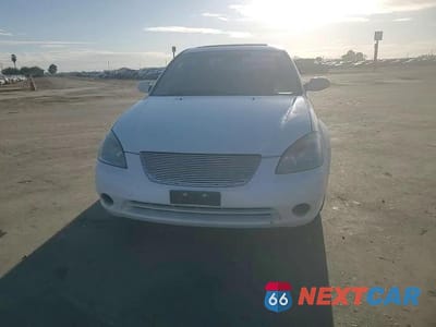 Zdjęcie 11 z 14 samochodu: 2003 NISSAN ALTIMA BASE VIN:1N4AL11D93C276964 - miniatura