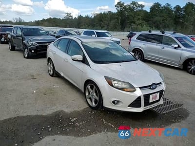 Zdjęcie 11 z 13 samochodu: 2013 FORD FOCUS TITANIUM VIN:1FADP3J25DL259382 - miniatura