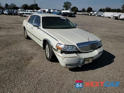 Zdjęcie 13 z 14 samochodu: 2004 LINCOLN TOWN CAR ULTIMATE VIN:1LNHM83W84Y640336 - miniatura