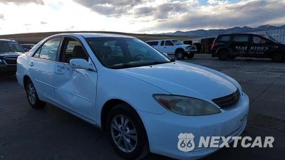 Zdjęcie 13 z 14 samochodu: 2004 TOYOTA CAMRY LE VIN:4T1BF32K44U073065 - miniatura