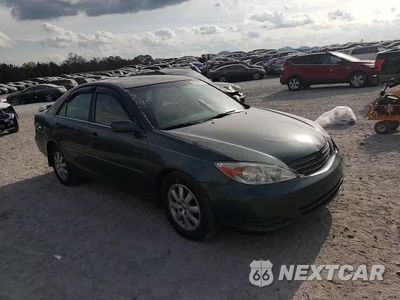 Zdjęcie 13 z 14 samochodu: 2002 TOYOTA CAMRY LE VIN:4T1BF32K52U506468 - miniatura