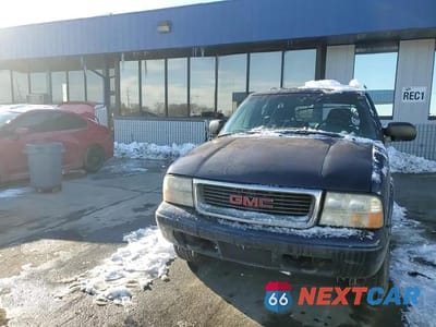 Zdjęcie 14 z 15 samochodu: 1999 GMC JIMMY VIN:1GKDT13WXX2558102 - miniatura