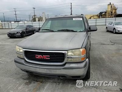Zdjęcie 14 z 15 samochodu: 2001 GMC YUKON VIN:1GKEC13T11J129101 - miniatura