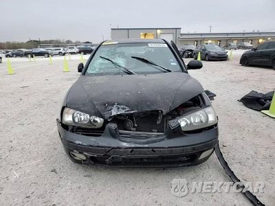 Zdjęcie 13 z 14 samochodu: 2002 HYUNDAI ELANTRA GLS VIN:KMHDN55D92U057946 - miniatura