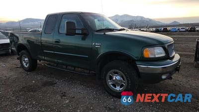 Zdjęcie 13 z 14 samochodu: 1999 FORD F150 VIN:1FTRX18L8XNB93468 - miniatura