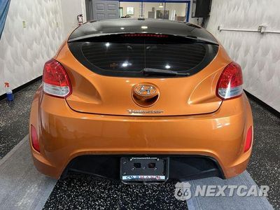 Czwarte zdjęcie samochodu z boku: 2014 HYUNDAI VELOSTER VIN:KMHTC6AD6EU183232 - miniatura