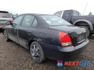 Trzecie zdjęcie samochodu z tyłu: 2003 HYUNDAI ELANTRA GLS VIN:KMHDN45D03U667861 - miniatura
