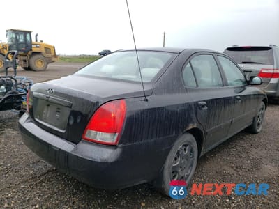 Czwarte zdjęcie samochodu z boku: 2003 HYUNDAI ELANTRA GLS VIN:KMHDN45D03U667861 - miniatura