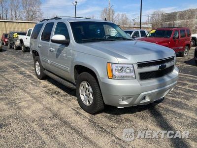 Czwarte zdjęcie samochodu z boku: 2011 CHEVROLET TAHOE K1500 LT VIN:1GNSKBE03BR157762 - miniatura