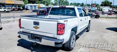 Czwarte zdjęcie samochodu z boku: 2014 CHEVROLET SILVERADO K1500 LTZ VIN:3GCUKSEC4EG308995 - miniatura