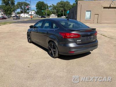 Zdjęcie 6 z 17 samochodu: 2015 FORD FOCUS TITANIUM VIN:1FADP3J27FL231666 - miniatura