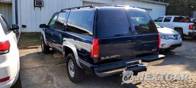 Czwarte zdjęcie samochodu z boku: 1999 GMC SUBURBAN K2500 VIN:3GKGK26R4XG505804 - miniatura