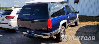 Trzecie zdjęcie samochodu z tyłu: 1999 GMC SUBURBAN K2500 VIN:3GKGK26R4XG505804 - miniatura