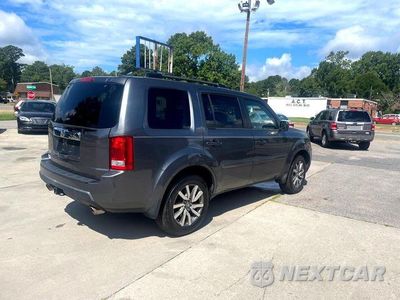 Piąte zdjęcie samochodu w środku: 2011 HONDA PILOT EX VIN:5FNYF3H40BB055370 - miniatura