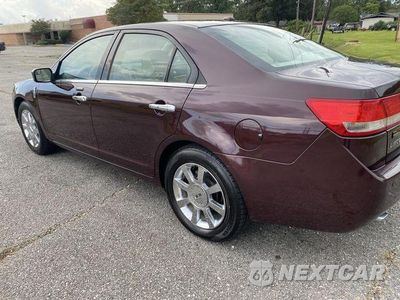 Czwarte zdjęcie samochodu z boku: 2011 LINCOLN MKZ VIN:3LNHL2JC2BR766969 - miniatura