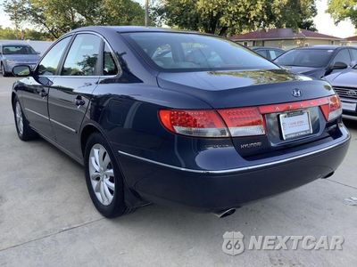 Piąte zdjęcie samochodu w środku: 2006 HYUNDAI AZERA SE VIN:KMHFC46F36A102766 - miniatura