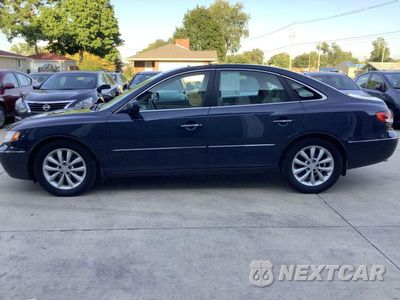 Czwarte zdjęcie samochodu z boku: 2006 HYUNDAI AZERA SE VIN:KMHFC46F36A102766 - miniatura
